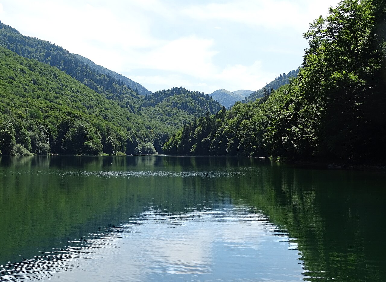 The Black Lake in Durmitor National Park, Montenegro, with pine forest and rocky peaks behind