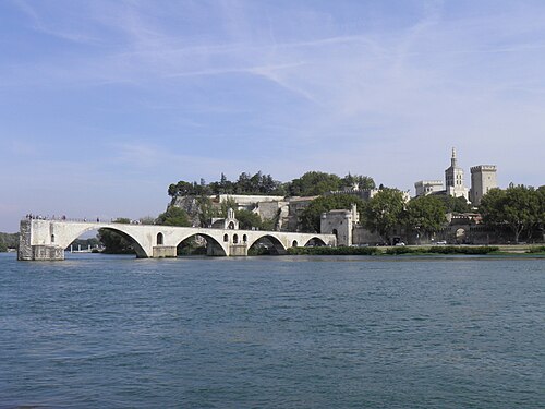 The broken Pont Saint-Bénézet over the Rhône in Avignon, with the cathedral and the Palais des Papes behind