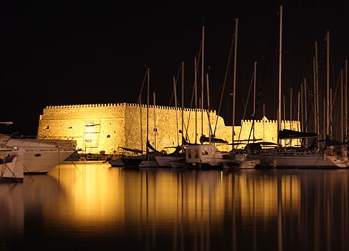 The Venetian Koules fortress at the harbor entrance in Heraklion, lit at night
