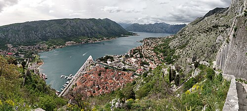 The old town of Kotor at the head of the Bay of Kotor, with the mountains behind it