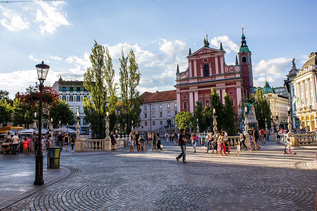 Prešeren Square in Ljubljana, with the pink Franciscan Church and the Triple Bridge