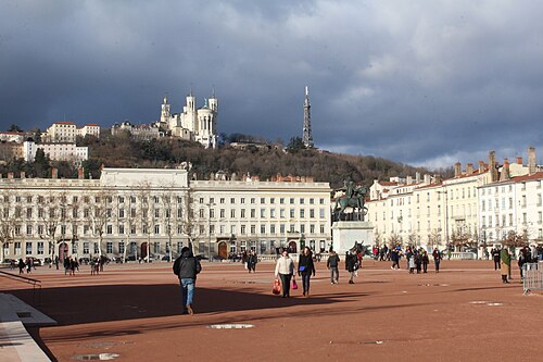 Place Bellecour in Lyon with its statue and the hill of Fourvière behind