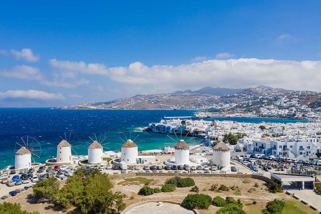 The windmills and the waterfront houses of Little Venice in Mykonos Town, seen across the water