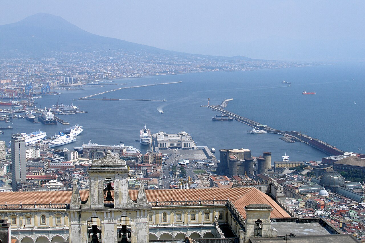 A view over the Bay of Naples and the port, with Mount Vesuvius rising in the distance
