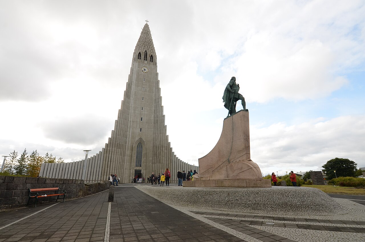 Hallgrímskirkja church with its tall stepped tower, and the statue of Leifur Eiríksson in front, in Reykjavík