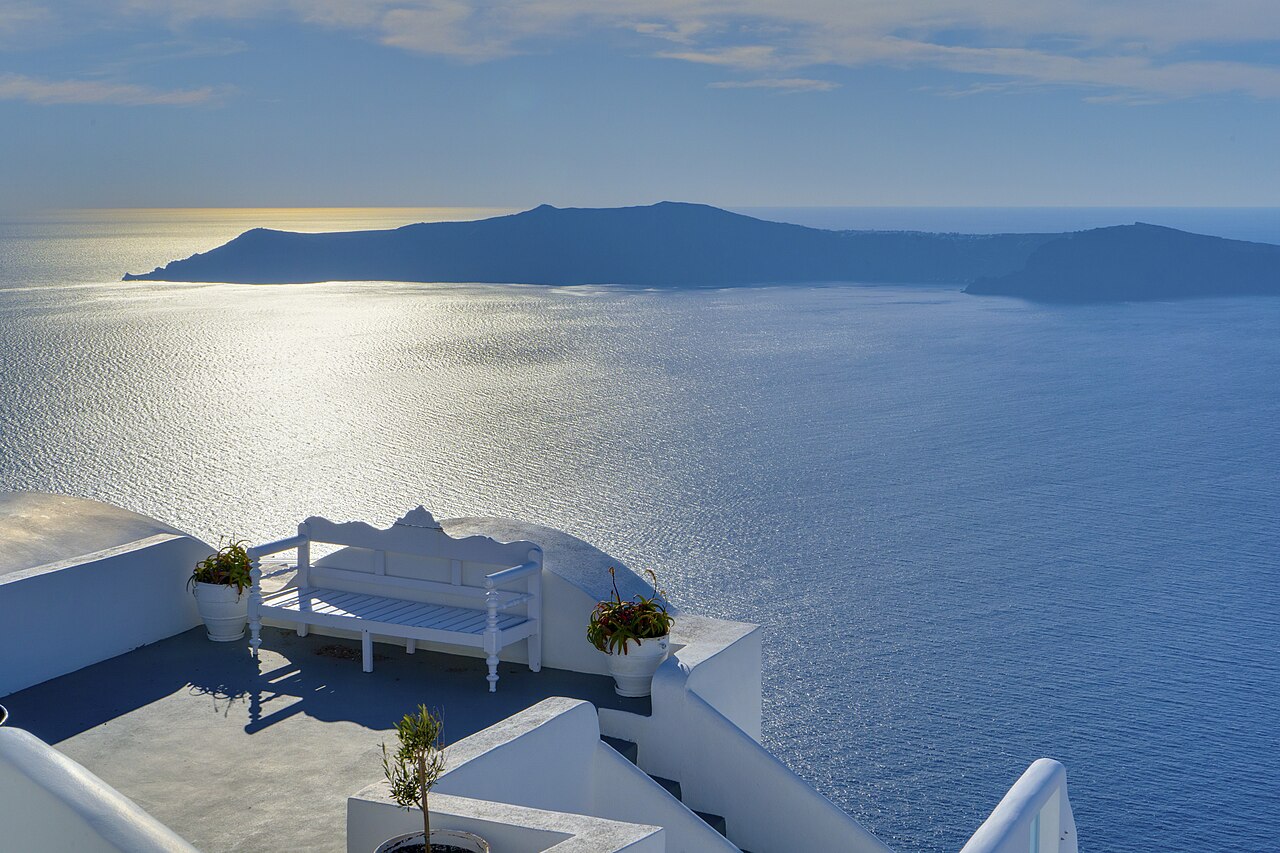 A whitewashed terrace in Oia looking out over the Santorini caldera