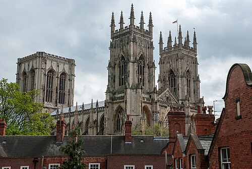 York Minster rising above the roofs, seen from the medieval city walls